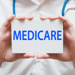 MD holding medicare sign MD holding medicare sign