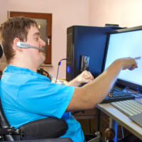 Disabled boy on computer