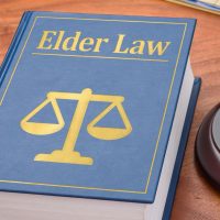 A law book with a gavel - Elder law