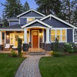Beautiful home exterior in evening with glowing interior lights