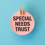 A pink and black sign that says Special Needs Trust on it
